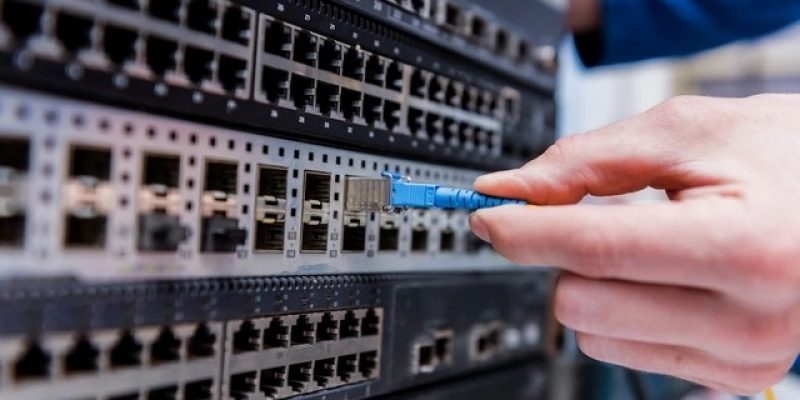 network-engineer-working-server-room-connecting-network-cables-switches_179755-6466-transformed